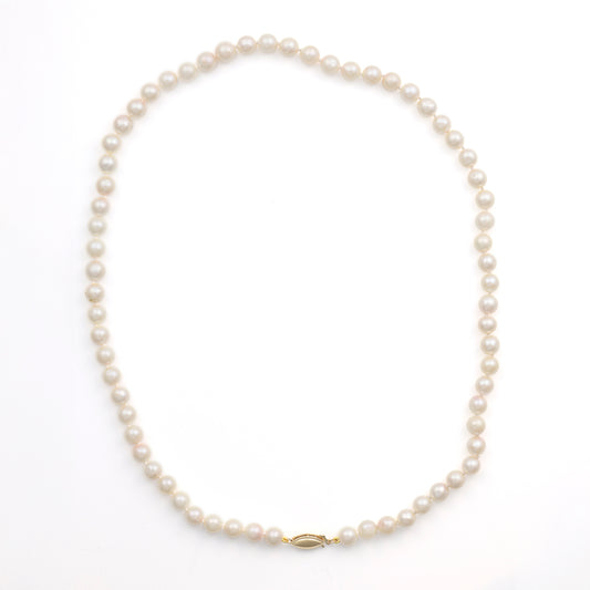 Akoya pearl necklace with yellow gold clasp.