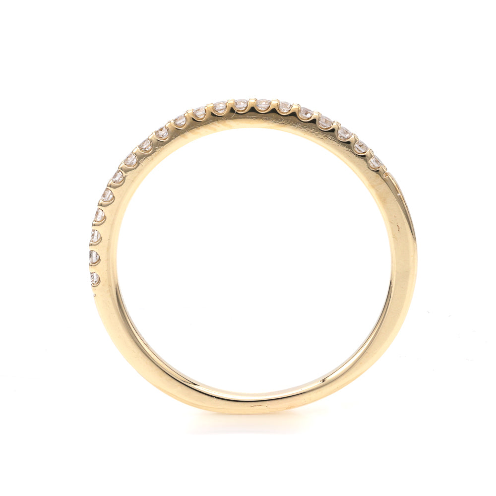 Yellow gold ring with diamond accents.