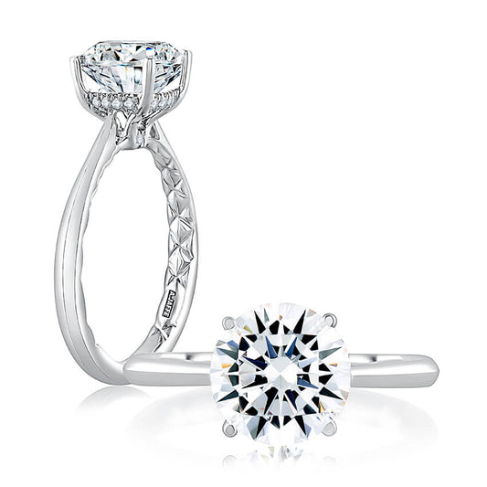 Platinum ring with solitaire diamond, hidden accents.