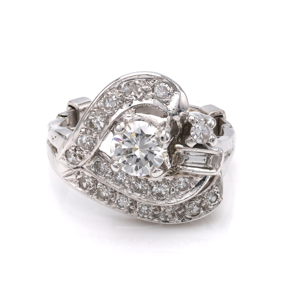 Platinum ring with round and baguette diamonds.