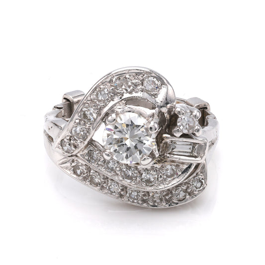 Platinum ring with round and baguette diamonds.