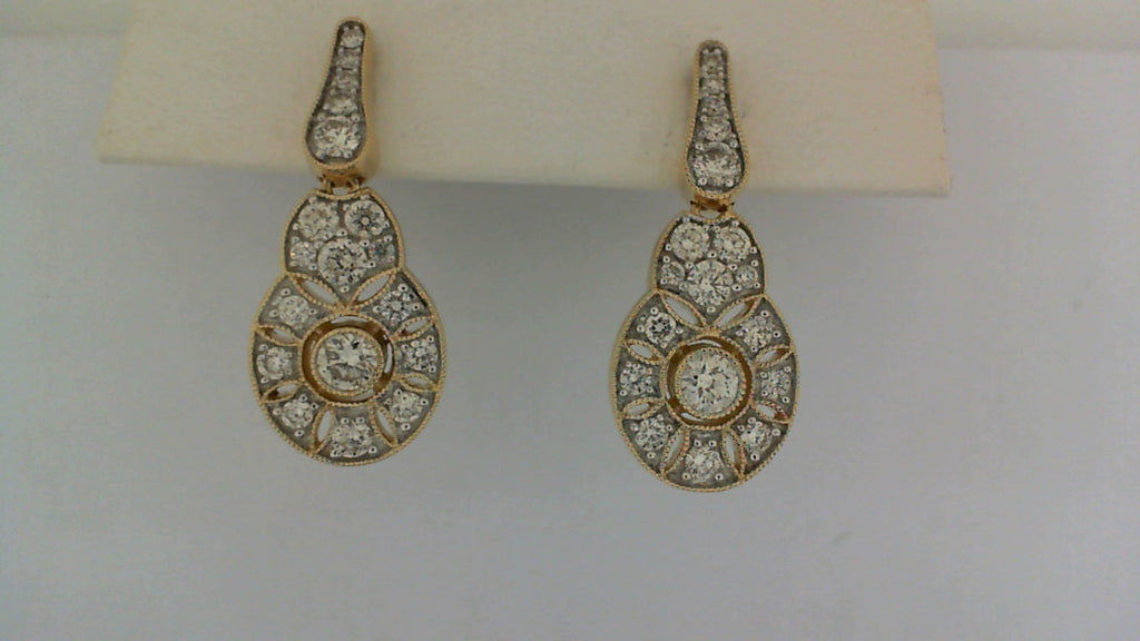 Gold drop earrings with round diamonds.