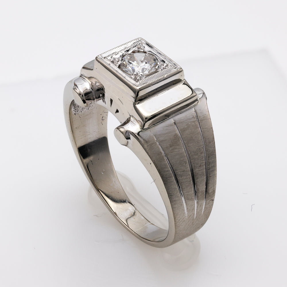14K white gold ring with round diamond.