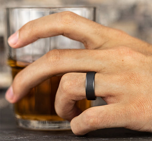 Tantalum black-grey matte carved band worn.