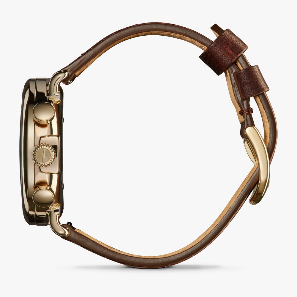 Brown leather strap, gold-tone stainless steel case.