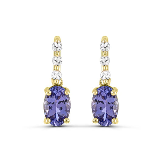 Tanzanite and diamond dangle earrings in gold.