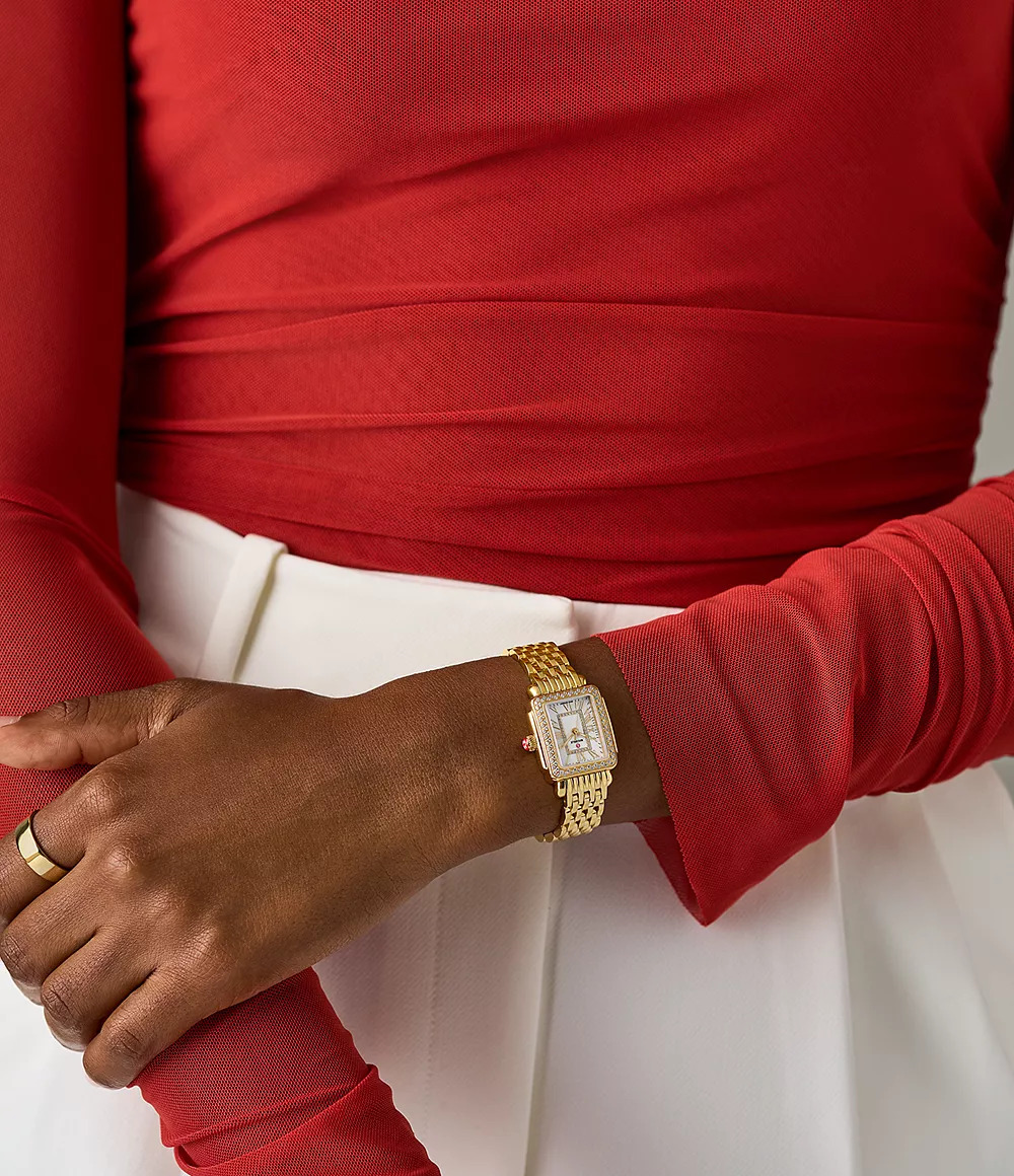 Gold-plated watch with diamond accents.