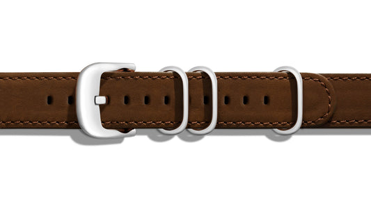 Dark brown leather watch band with buckle.