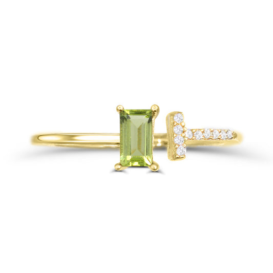 Baguette peridot ring with diamond accents.
