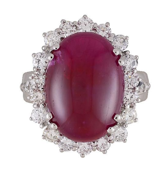 Cabochon ruby ring with diamond halo.