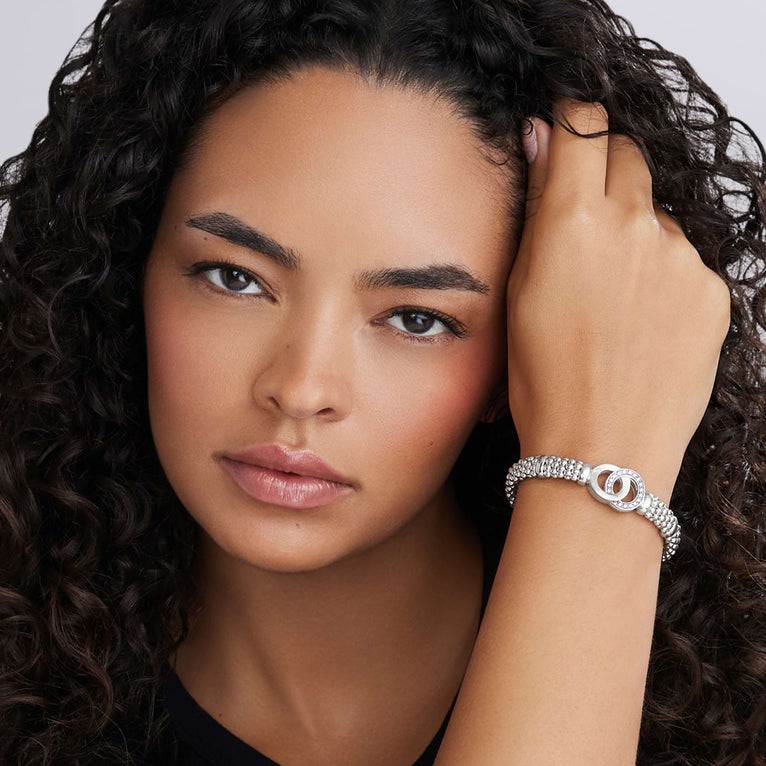 Sterling silver diamond bracelet on wrist.