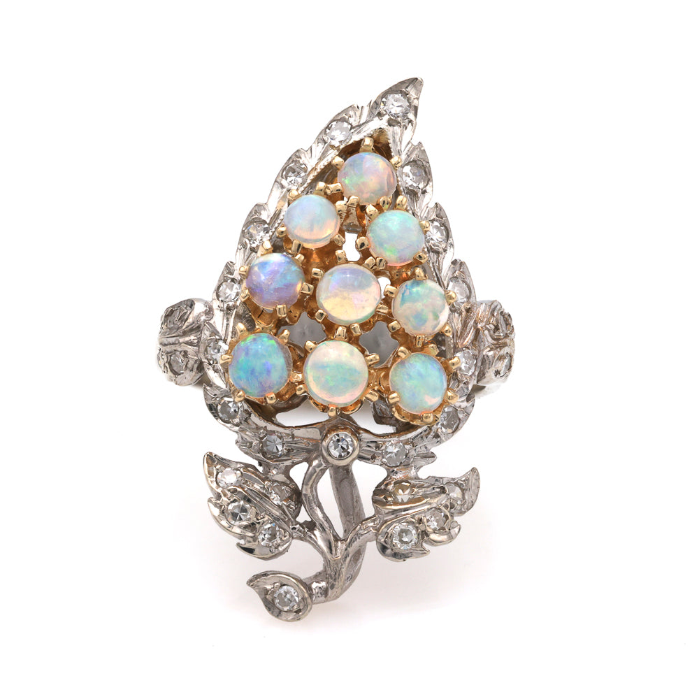 Opal and diamond ring with leaf design.