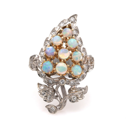 Opal and diamond ring with leaf design.