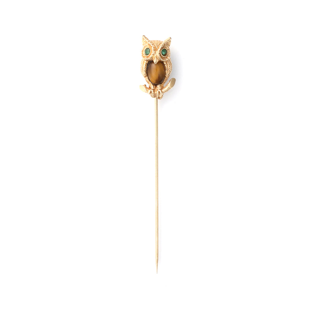 Owl-shaped brooch with Tiger Eye and emeralds.