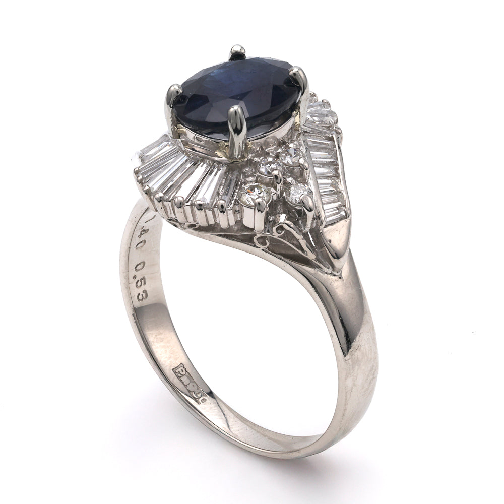 Platinum ring with oval sapphire centerpiece.