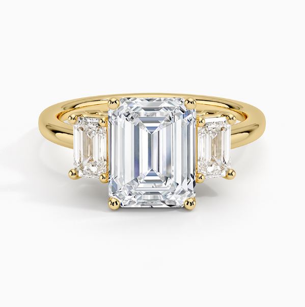 Three-stone emerald-cut diamond ring.