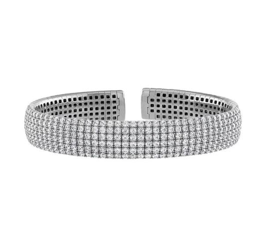 Diamond bracelet, white gold, flexible bangle design.