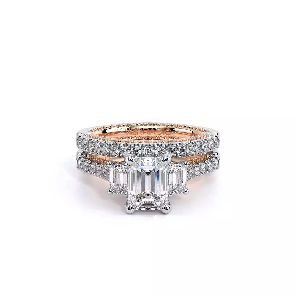 Emerald-cut diamond ring with rose gold accents.