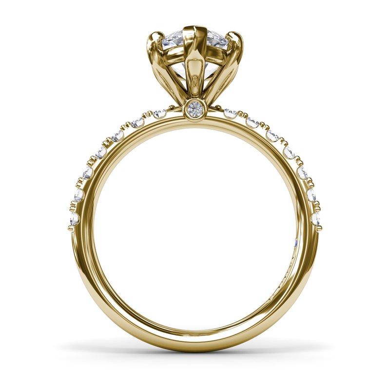 Gold ring with diamond accents and prong setting.