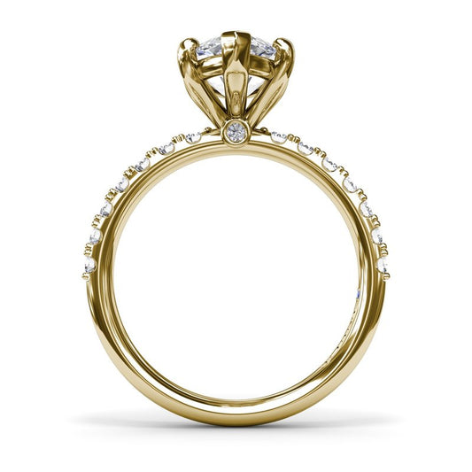 Gold ring with diamond accents and prong setting.