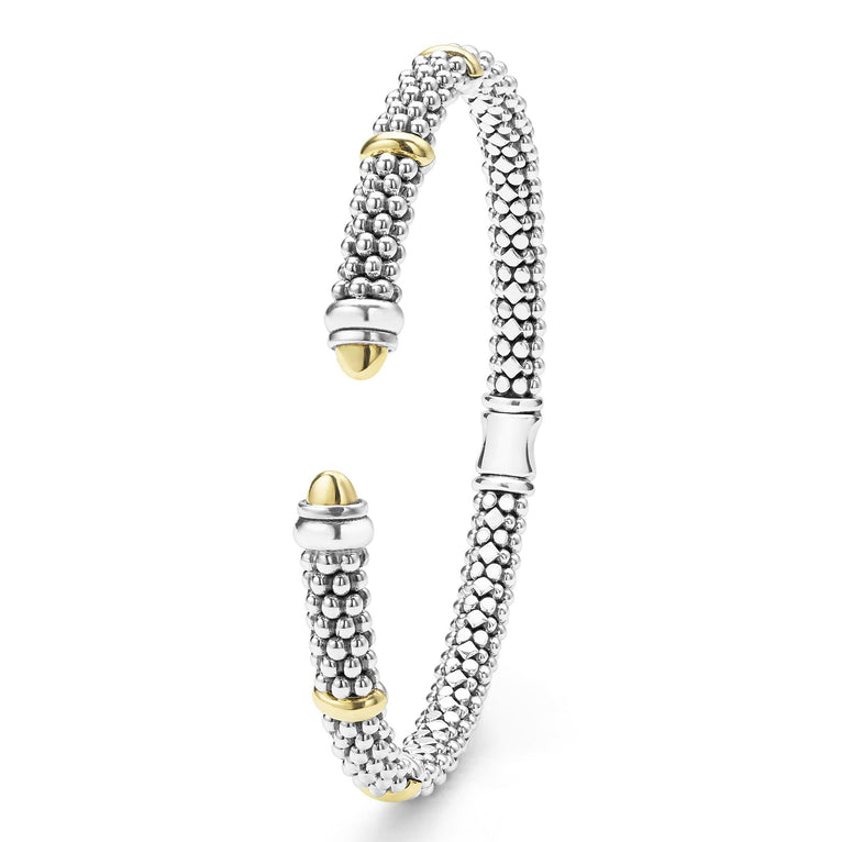 Sterling silver cuff with gold accents.