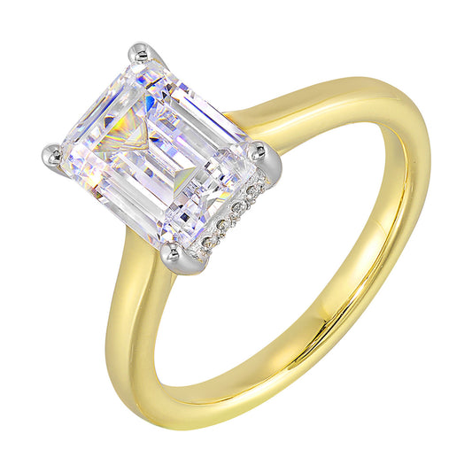 Yellow gold ring with emerald-cut diamond.