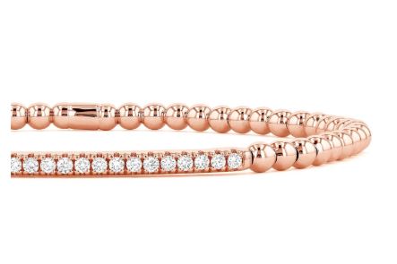 Rose gold bracelet with various shaped diamonds.