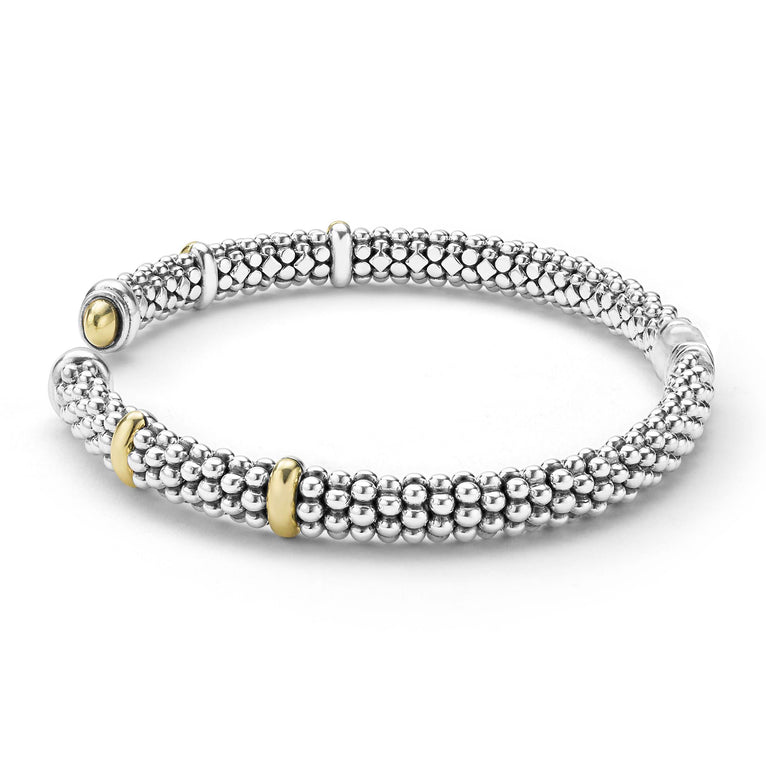 Sterling silver cuff with gold accents.