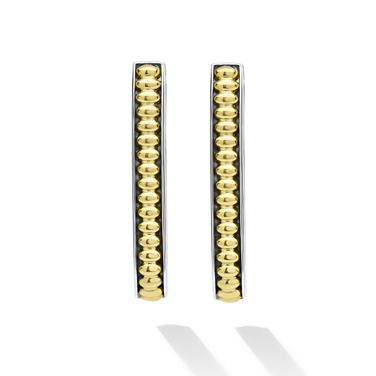 Sterling silver oval hoops with beaded design.