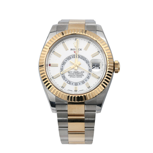 Stainless steel watch with gold accents.