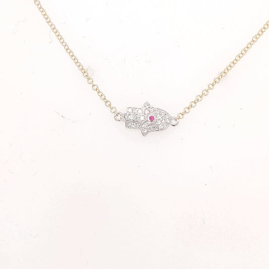 Hamsa necklace with diamonds and central ruby.