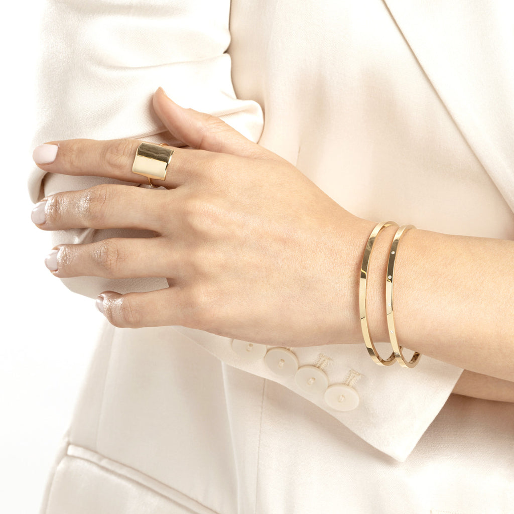 10K yellow gold bangle bracelet, sleek design.