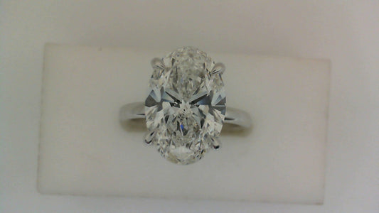 Oval diamond solitaire ring in white gold.