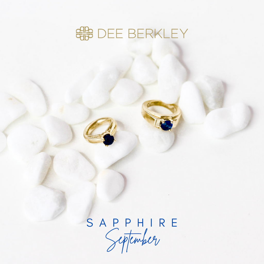 Gold rings with blue sapphires on stones.
