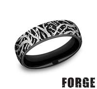 Black titanium ring with engraved pattern.