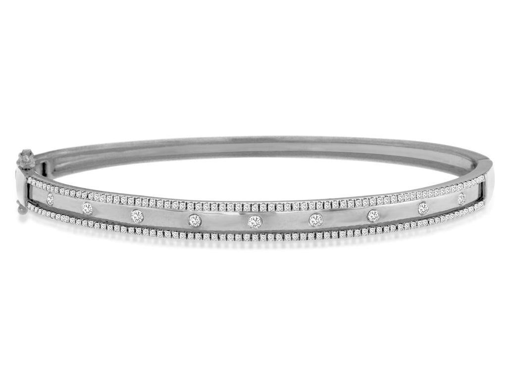 Elegant diamond bangle with round stones.