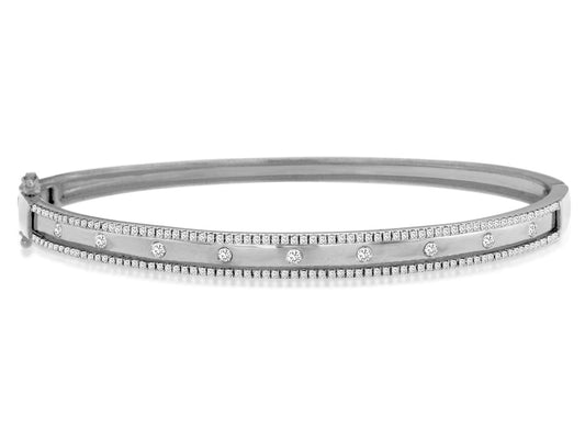 Elegant diamond bangle with round stones.