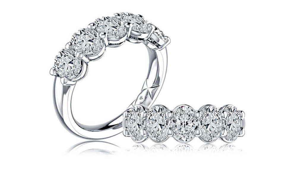 Oval diamond wedding band in white gold.