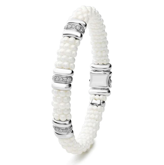 White ceramic bracelet with diamond accents.