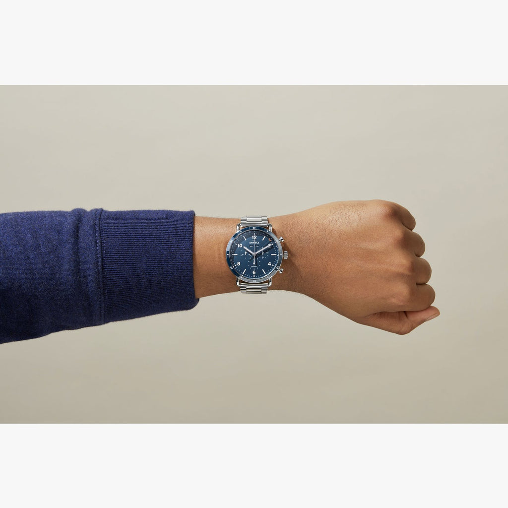 Stainless steel watch with light blue dial.
