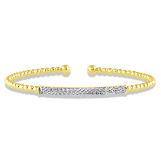 Yellow gold bracelet with round diamond accents.