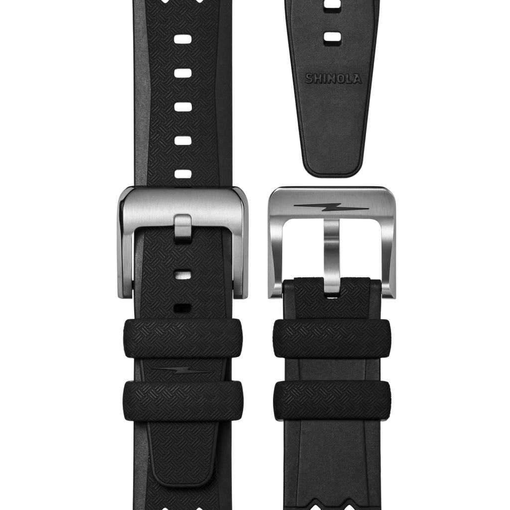 Black rubber watch band with stainless steel buckle.