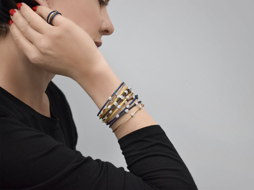 Blue diamond bracelet with stainless steel cable.