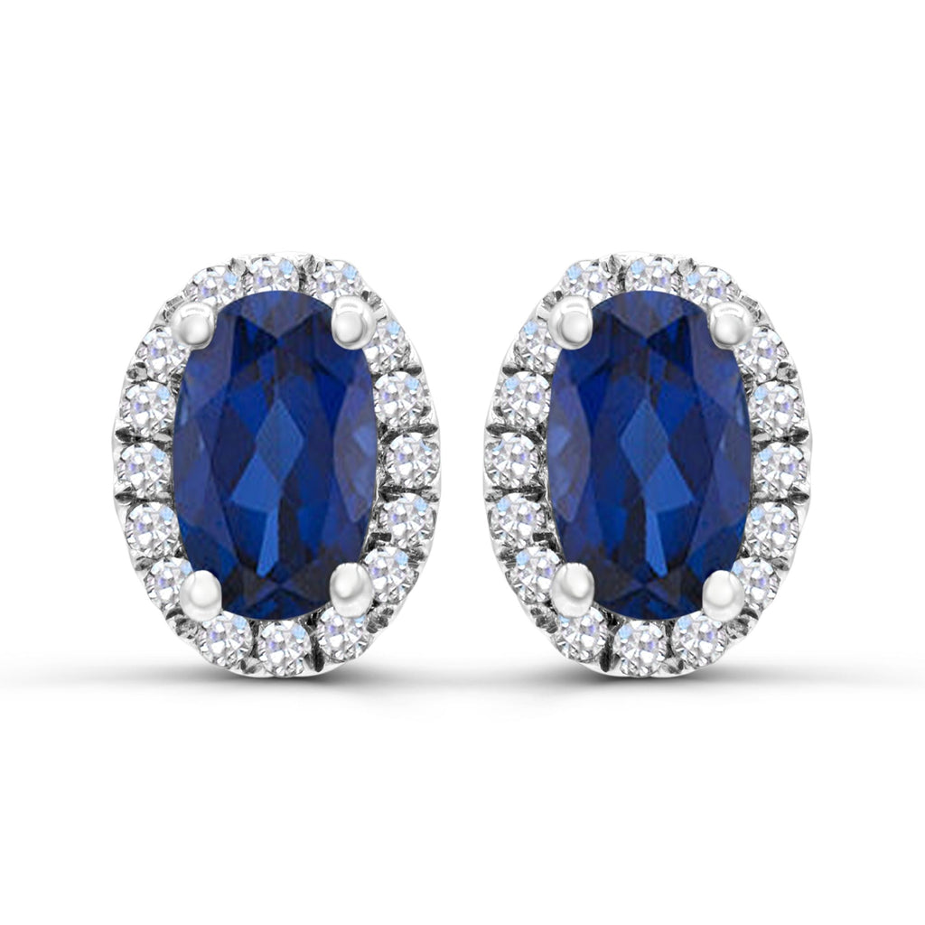 Oval sapphire earrings with diamond accents.