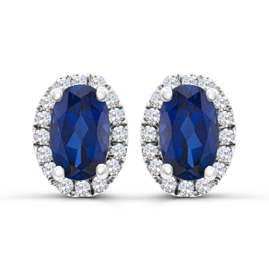 Oval sapphire earrings with diamond accents.