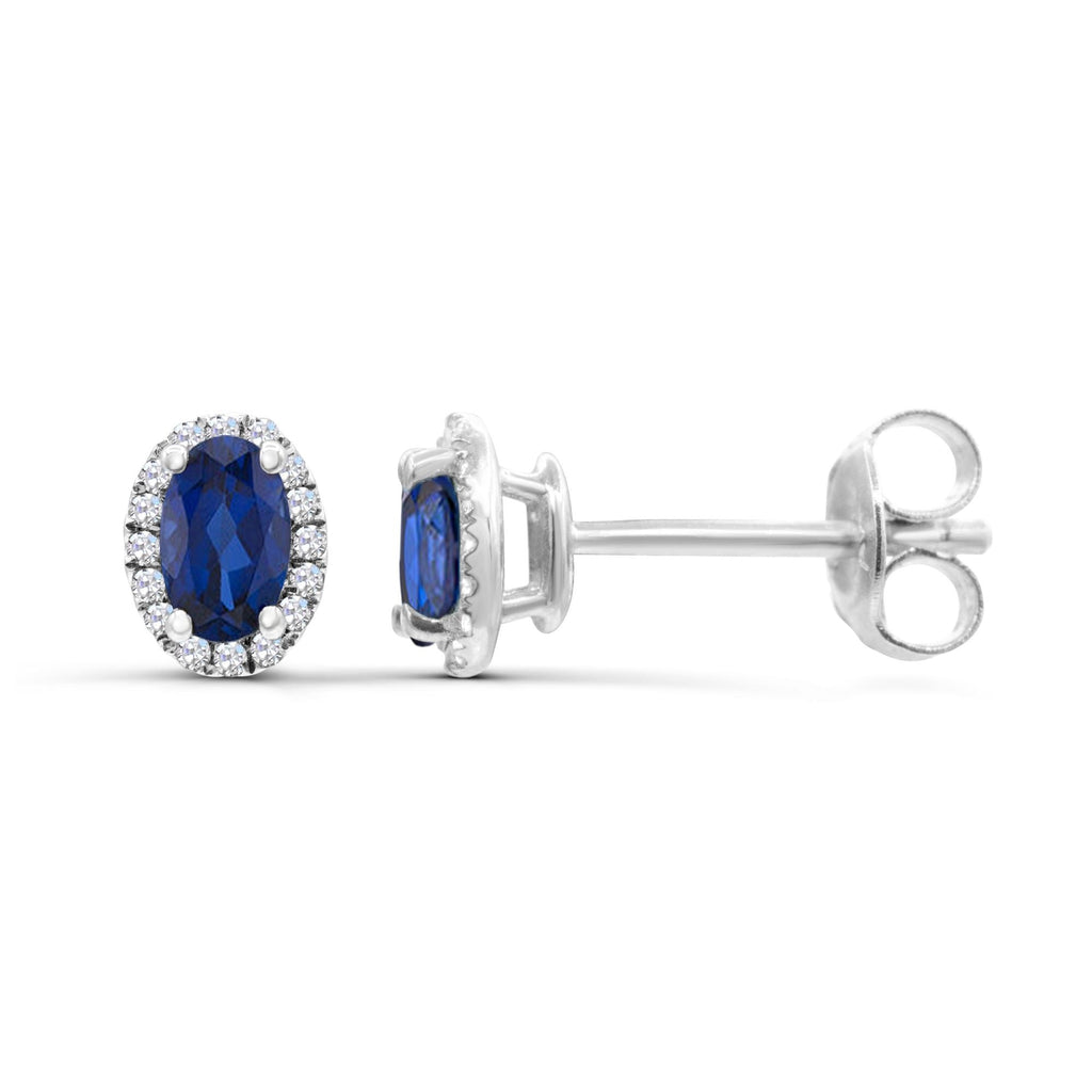 Oval sapphire earrings with diamond halo.