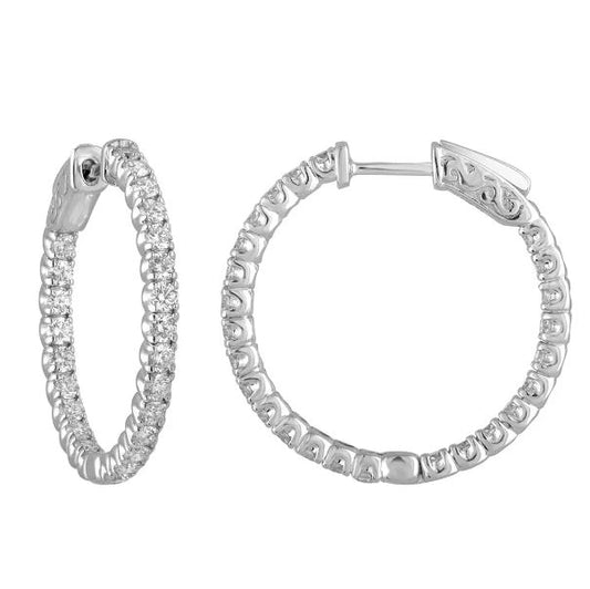 Medium white gold diamond hoop earrings.