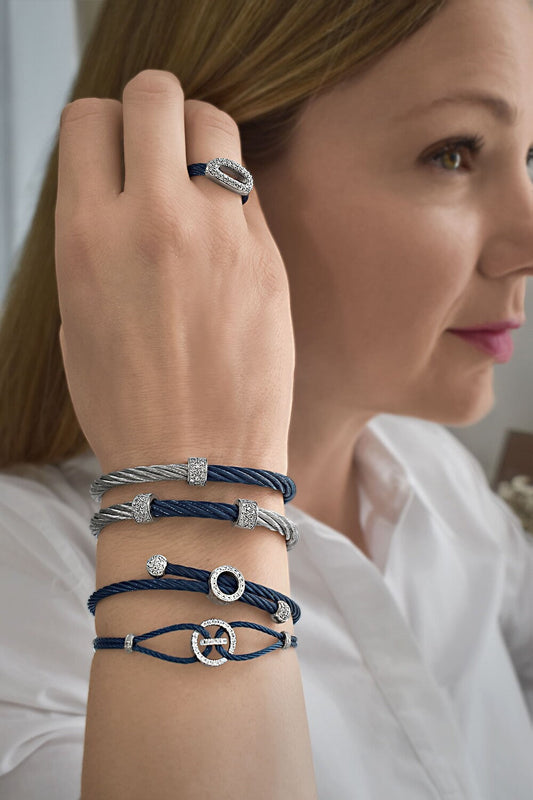 Blue and silver diamond-accented cable bracelets.