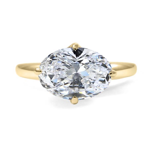 Oval diamond solitaire ring, yellow gold band.