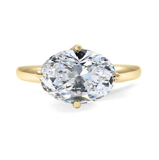 Oval diamond solitaire ring, yellow gold band.